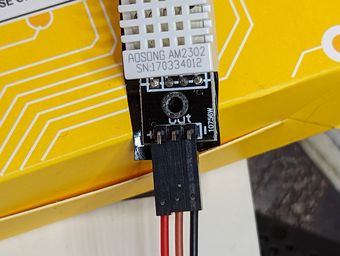 DHT22 with black tape on the back to prevent shorting